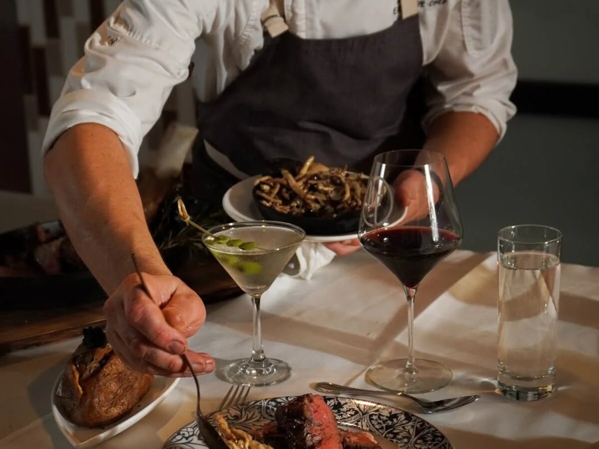 Master Chef Preparing Gourmet Dish at Tipsy Palates